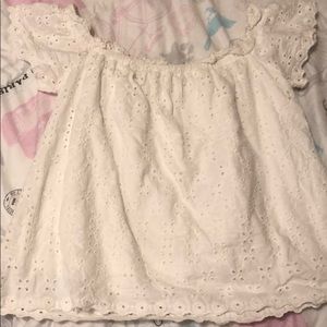 This is an off shoulder cropped shirt.